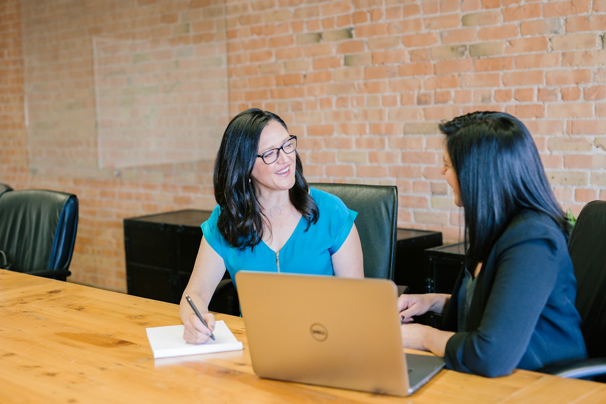 Business consultant discussing paperwork with clients
